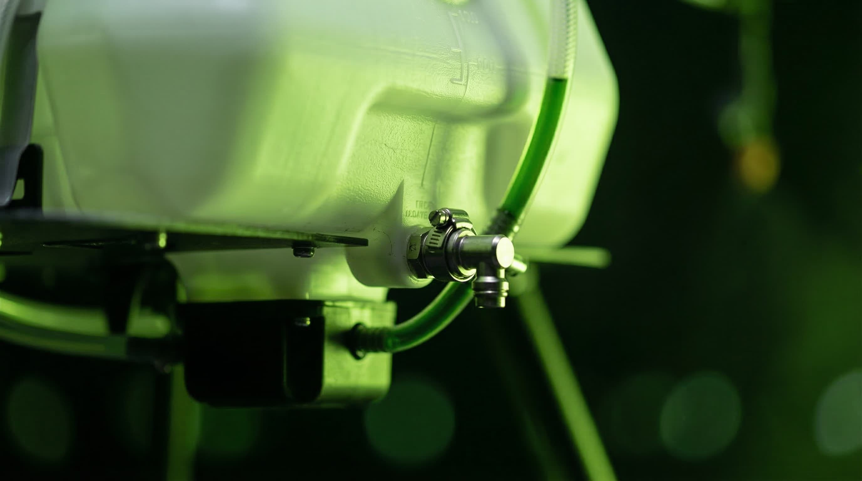 Atlas Ag — tank body with outlet valve and green flow tube macro